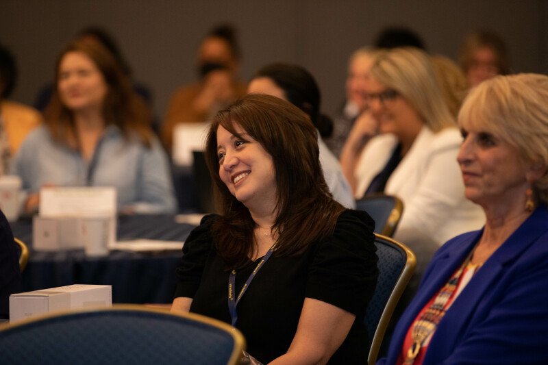 Attendee listening to Selena Rezvani's keynote at EA Ignite Spring 2023
